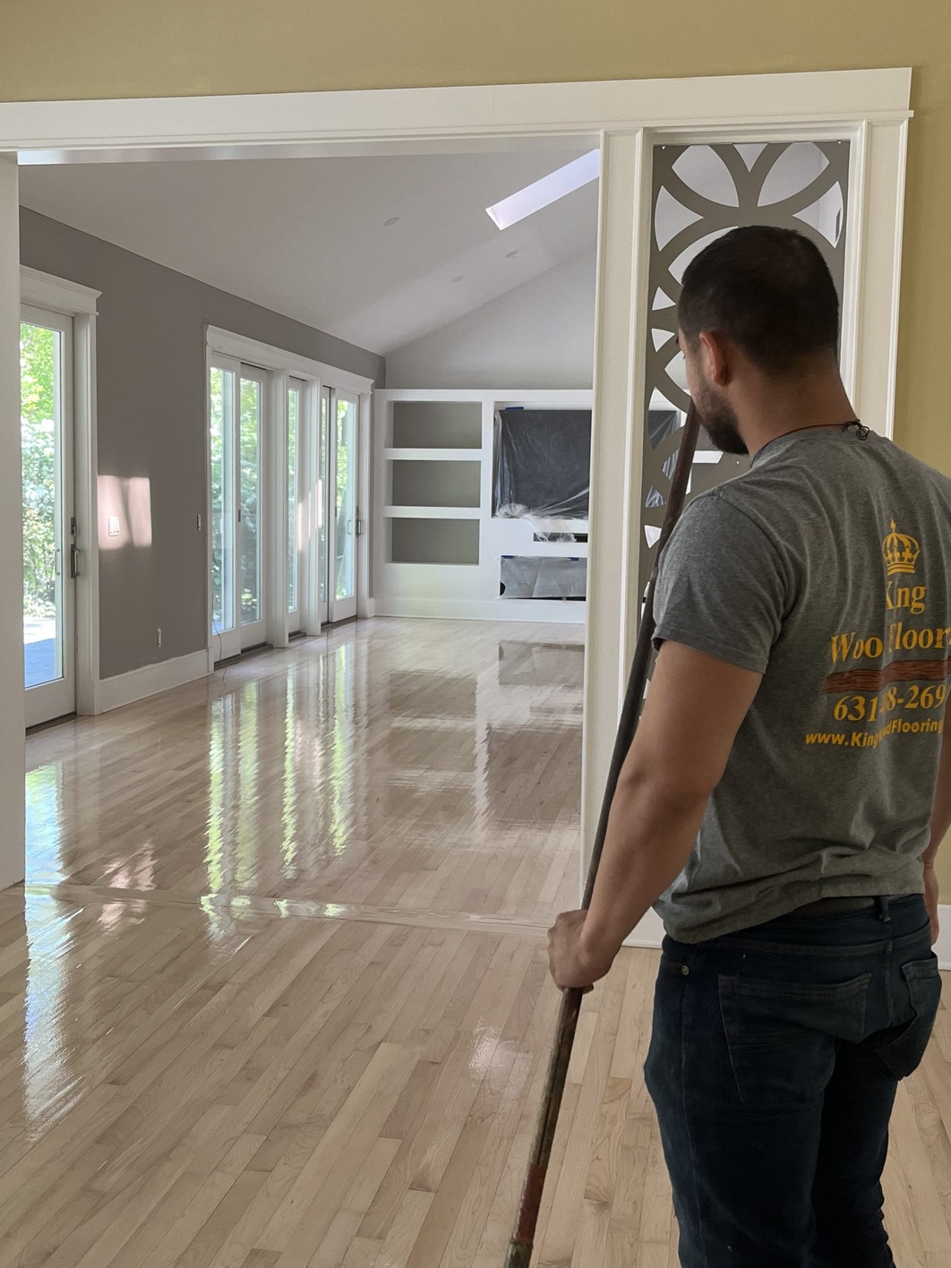 Founder of King wood standing in a wood floor